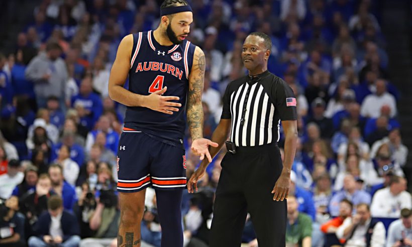 Auburn Tigers forward Johni Broome (4) talks with a referee in a game between the Auburn Tigers and the Kentucky Wildcats at Rupp Arena on Saturday, March 1, 2025.