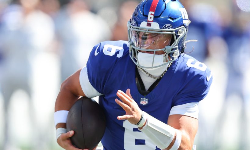 Jaxson Dart #6 of the New York Giants runs and scores his first NFL touchdown during the first quarter of the game against the Los Angeles Chargers on September 28, 2025 at MetLife Stadium in East Rutherford, New Jersey.