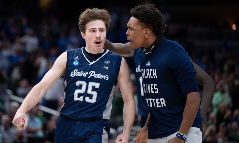 Saint Peter's Peacocks guard Doug Edert (25) celebrates after a three pointer during the menÕs March Madness college basketball game between the Kentucky Wildcats and Saint Peters Peacocks on March 17, 2022, at Gainbridge Fieldhouse in Indianapolis, IN.