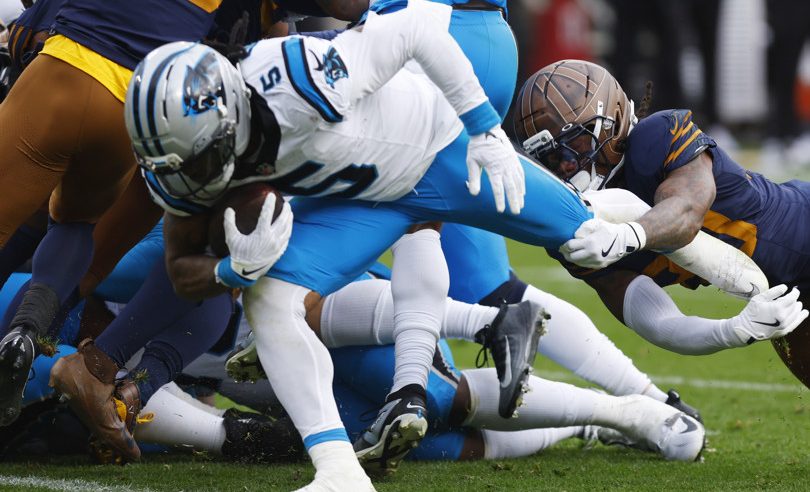 Carolina Panthers running back Rico Dowdle (5) scores a touchdown during a game between the Green Bay Packers and the Carolina Panthers at Lambeau Field on November 2, 2025 in Green Bay, WI.
