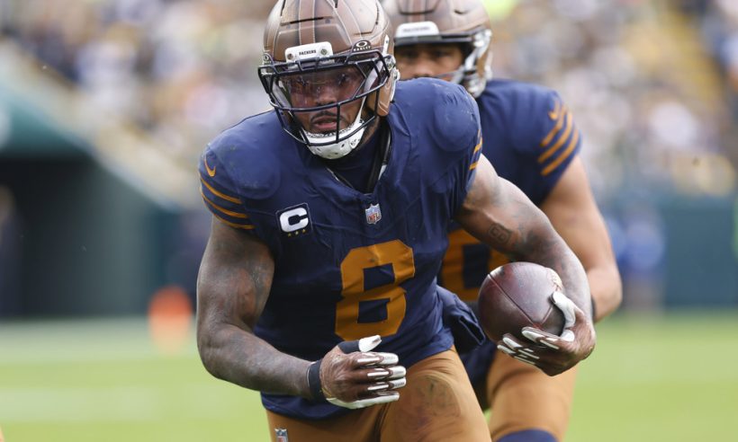 Green Bay Packers running back Josh Jacobs (8) scores a touchdown during a game between the Green Bay Packers and the Carolina Panthers at Lambeau Field on November 2, 2025 in Green Bay, WI.