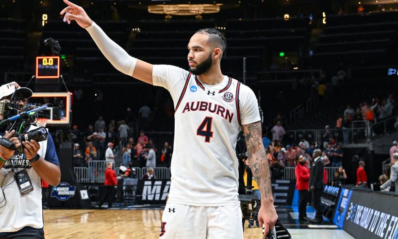 Auburn forward Johni Broome (4) acknowledges the fans following the conclusion of the South Regional Sweet Sixteen round of the NCAA Men's Basketball Tournament game between the Michigan Wolverines and the Auburn Tigers on March 28th, 2025 at State Farm Arena in Atlanta, GA.