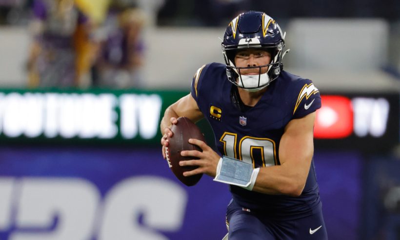 Los Angeles Chargers quarterback Justin Herbert (10) runs the football during the NFL game between the Minnesota Vikings and the Los Angeles Chargers on October 23, 2025, at SoFi Stadium in Inglewood, CA.